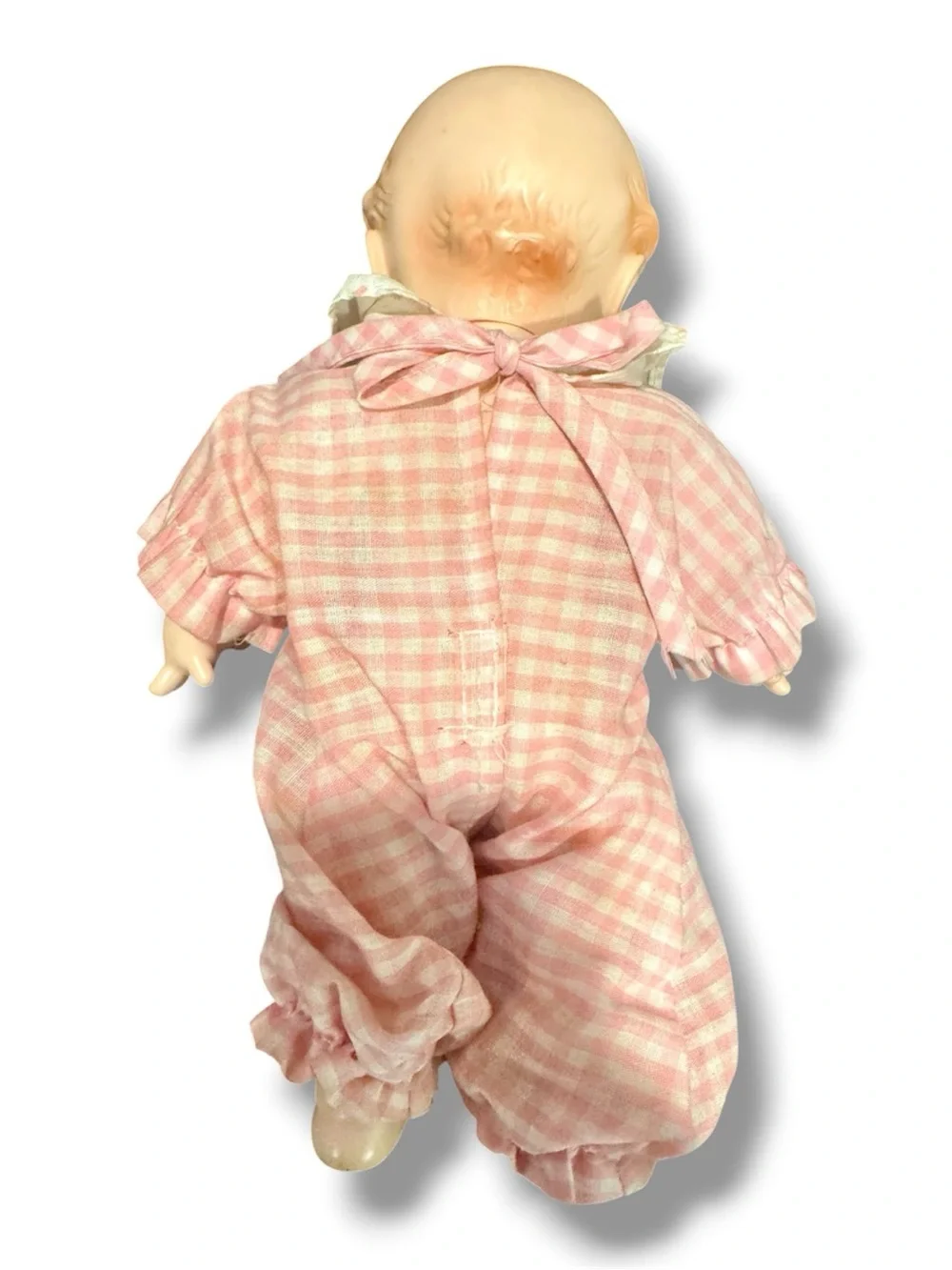 Vintage Kewpie Doll for Collectors, in pink ruffled outfit.